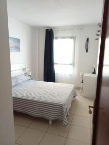 Postel nebo postele na pokoji v ubytování Casa Elsa appartamento incantevole Corralejo