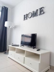 TV a/nebo společenská místnost v ubytování Casa Elsa appartamento incantevole Corralejo