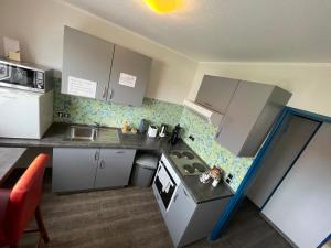 Kuchyň nebo kuchyňský kout v ubytování Ben's HOME