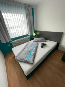 Postel nebo postele na pokoji v ubytování Ben's HOME + 1 fotografie