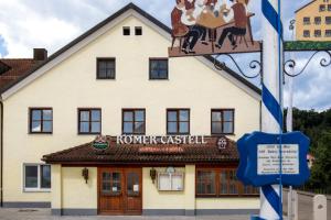 a building with a sign in front of it at Römercastell Wirtshaus & Hotel in Böhming
