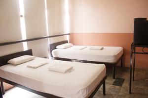Letto o letti in una camera di GV Hotel - Ormoc