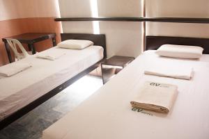 Letto o letti in una camera di GV Hotel - Ormoc