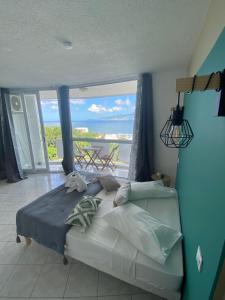Voodi või voodid majutusasutuse Oceanview Martinique toas