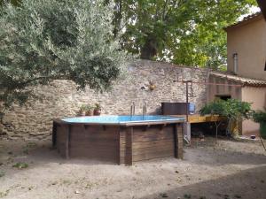 Bazén v ubytovaní Maison Familiale, Jardin Piscine hors sol - Rustique - Au Coeur des Corbières alebo v jeho blízkosti