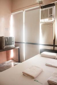 Postel nebo postele na pokoji v ubytování GV Hotel - Ormoc