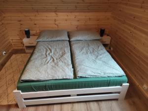 Postel nebo postele na pokoji v ubytování Domek na Blejchu