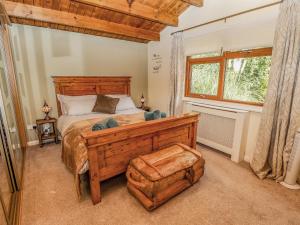 a bedroom with a large bed and a window at Lakeside Lodge Retreat in Tattershall