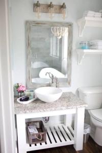 a bathroom with a sink and a mirror at Primrose Cottage - Private Lake, Hot Tub, ATV Trails in Mena