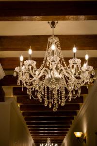 a chandelier hanging from a ceiling in a room at Royalty Hotel Boutique Puebla in Puebla