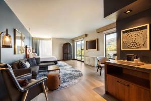 a living room with a couch and a table at Indigo - Silverthorne, an IHG Hotel in Silverthorne