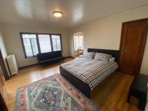 a bedroom with a bed and a rug at Furnished Apartments - Climate Pledge Arena Next Door in Seattle