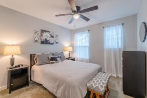 a bedroom with a bed and a ceiling fan at Eastlawn Place cozy 2 bdrm townhome near downtown San Antonio in San Antonio