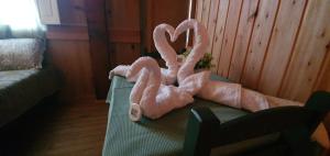 a large pink stuffed animal sitting on a table at Casarão Biazolli in Farroupilha
