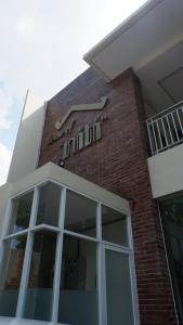 a brick building with a sign on top of it at HOUSE OF NITI in Alastuwo