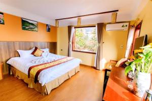 Postel nebo postele na pokoji v ubytování Heart Of Sapa Hotel