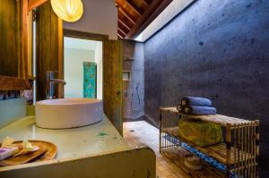 a bathroom with a bath tub and a sink at 3 BDRMS private VILLA - Bingin Beach in Uluwatu