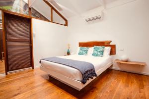 Voodi või voodid majutusasutuse Daintree Wilderness Lodge toas