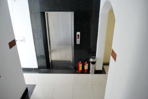 a bathroom with a urinal with bottles on the floor at Lan Anh Hotel in Ho Chi Minh City +26 photos