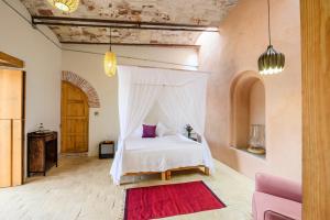 Ένα ή περισσότερα κρεβάτια σε δωμάτιο στο Ex Hacienda San José