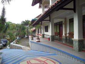 a building with a no parking sign in front of it at Sukapura Permai Hotel in Lambangkuning