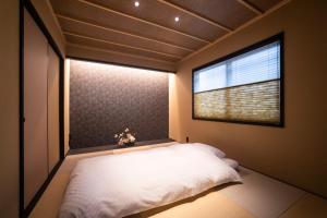 Cama ou camas em um quarto em Rinn Kiyomizu Gojo Machiya North