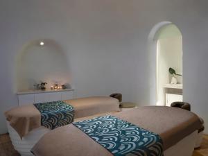 Letto o letti in una camera di JHL Solitaire Gading Serpong