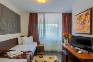 TV a/nebo společenská místnost v ubytování Hotel Tranzzit