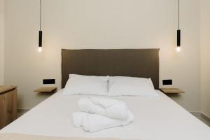 Postel nebo postele na pokoji v ubytování Olvion Suites