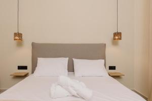 Postel nebo postele na pokoji v ubytování Olvion Suites