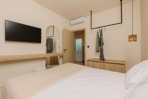 Postel nebo postele na pokoji v ubytování Olvion Suites