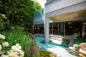 a garden in front of a building at Otaru Asari Classe Hotel in Otaru