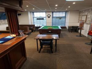 a conference room with a pool table and a desk at OYO The Shores Hotel, Central Blackpool in Blackpool