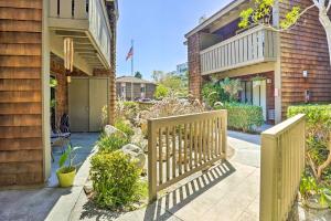 a fence in front of a house at Stylish Dana Point Getaway 1 Mi to Beach! in Dana Point