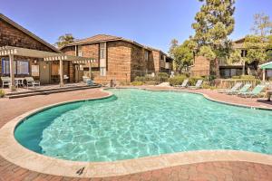 a swimming pool in front of a house at Stylish Dana Point Getaway 1 Mi to Beach! in Dana Point