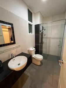 a bathroom with a sink and a toilet and a shower at 1Medini 1BedRoom NiceView By WP Homestay in Johor Bahru