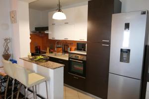 Kuchyňa alebo kuchynka v ubytovaní APARTMENT MARKO