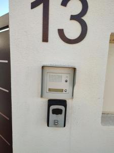 a parking meter with the number thirteen on it at Casa Patrizia in Olbia