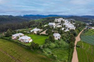 an aerial view of a house in the mountains at Sterling Ooty Fern Hill in Ooty