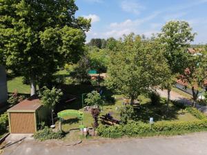 an aerial view of a park with benches and trees at Gasthaus Pension Schumbert in Bullau