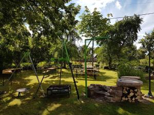 a park with a swing set and a playground at Gasthaus Pension Schumbert in Bullau