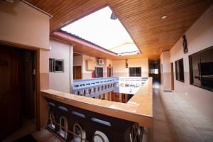 a large kitchen with a large skylight in a building at Bombay Hotel in Accra