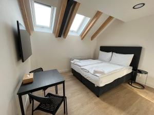 Posteľ alebo postele v izbe v ubytovaní Figaro Suites