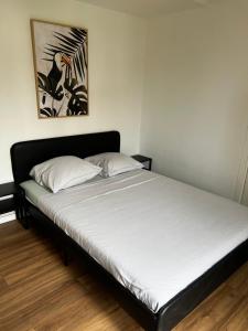 Кровать или кровати в номере Appartement Prox Lycée Arago