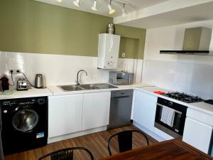 Кухня или мини-кухня в Appartement Prox Lycée Arago
