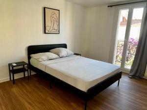 Кровать или кровати в номере Appartement Prox Lycée Arago