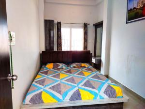 Postel nebo postele na pokoji v ubytování Khushi Paying Guest House
