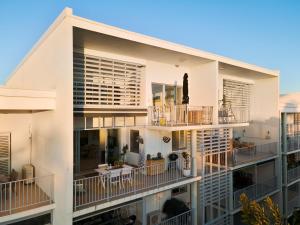 an aerial view of a building with balconies at 3 Bedroom Penthouse - Short Walk to Sandstone Point in Bongaree