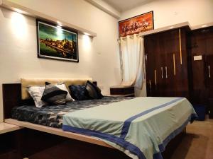 Postel nebo postele na pokoji v ubytování Khushi Paying Guest House