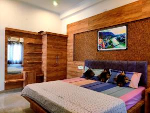 Postel nebo postele na pokoji v ubytování Khushi Paying Guest House